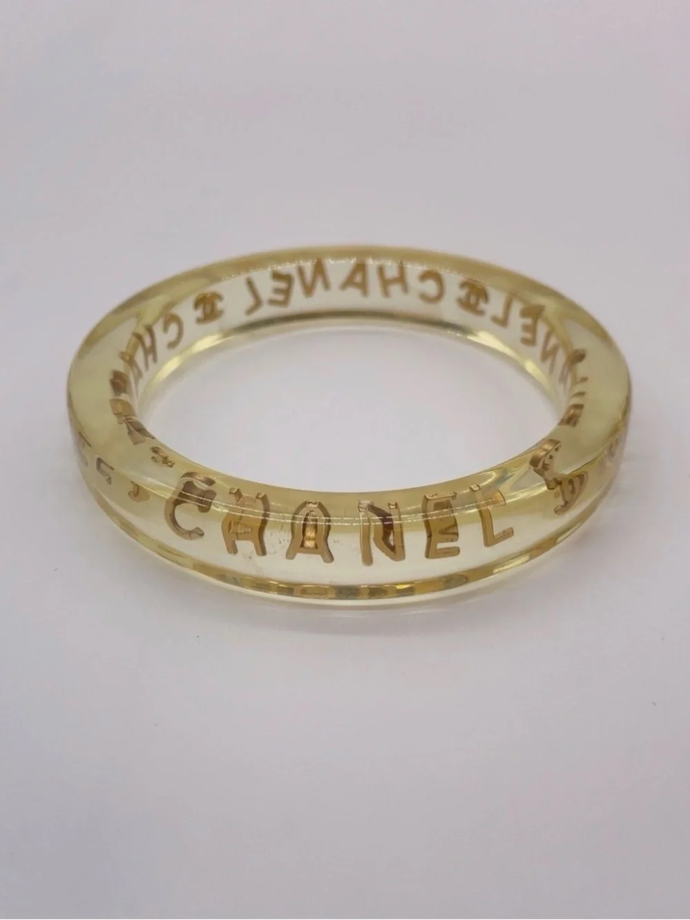 CHANEL LUCITE & Gold Letter Clear Acrylic Bangle - Picture 9 of 12